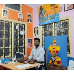 Me at my desk in the studio. Every portrait you see on this page was created right here in this room.