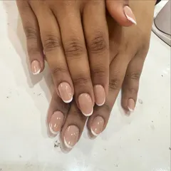 Simplicity at its best. This is a perfect, classic French manicure on short, rounded nails, proving that this timeless look is beautiful at any length.