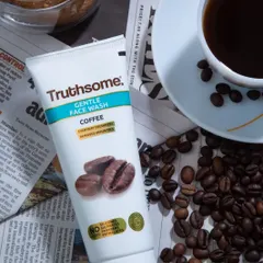 A lifestyle product shot for a coffee-based face wash. I used a newspaper, coffee beans, and a cup of coffee as props to build a narrative around the product's main ingredient.