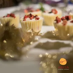 Delicate white chocolate cups filled with a creamy mousse and topped with freeze-dried raspberries. This dessert is a perfect bite-sized indulgence, offering a delightful contrast of sweet and tart flavors.