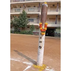 The Kho-Kho pole, decorated with flowers during our Dussehra puja. We treat every part of our sport with reverence.