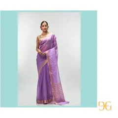 From my Champa collection, this ethereal African Violet silk organza saree is exceptionally lightweight and festive. It is woven with delicate gold zari checks, and the pallu features an interesting play of geometric and floral motifs, creating a dreamy and sophisticated drape.