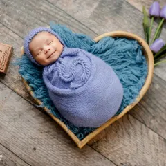 Capturing a newborn's first smile is pure magic. I use careful timing and a comfortable environment in my studio to catch these fleeting, precious expressions.