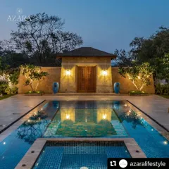 The entrance to Casa Azara in Goa is defined by this stunning pool and entryway. Symmetrical planting and dramatic lighting create a formal, elegant approach that reflects in the still water at night.