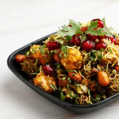 A healthy yet indulgent snack. Our Makhana Chaat features roasted fox nuts tossed with spices, peanuts, and fresh herbs, creating a light, crunchy, and flavourful dish that guests love.