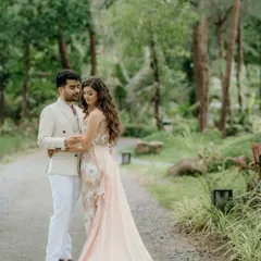 A romantic portrait of the couple in a lush, green setting for their pool party. We use natural landscapes to create a soft and beautiful backdrop.