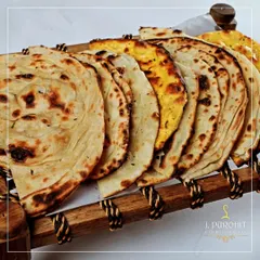 No Indian meal is complete without bread. I offer a variety of freshly made Indian breads, including soft naan and flaky lachha paratha, served warm.