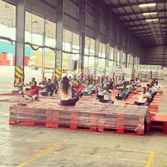 Guiding the group through a seated meditation to begin our session. Even in a large warehouse, we were able to create a space for quiet reflection and mindfulness.