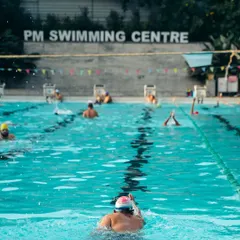 Our training isn't just for kids. Here, an adult swimmer practices their form in one of our dedicated lanes. We offer a supportive, judgment-free environment for adults to learn, improve their strokes, and build water confidence.