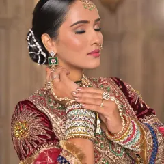 A close-up showcasing the soft, warm tones of the eye makeup and the radiant skin. I also styled her hair in an elegant bun, adorned with pearls, to complete this regal look.