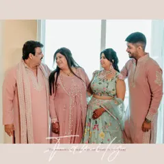 A heartwarming family portrait from the Haldi ceremony. The coordinated pastel outfits and the loving interaction between family members make this a precious memory.