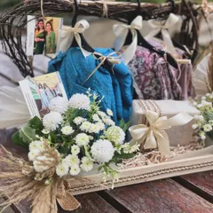 A close-up on the fresh white chrysanthemums and dried grasses used in the birthday hanger hamper. This detail highlights the soft, natural aesthetic I created for this summer-themed gift.