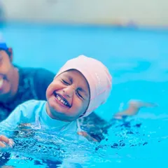 The pure joy of learning to swim. Our lessons are filled with laughter and positive reinforcement, making the pool a place where children feel happy and accomplished.