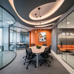 Here, an orange accent wall and a dynamic, curved ceiling with integrated lighting create a focal point in this meeting space. This demonstrates my approach to using bold design elements to energize key areas within a corporate environment.