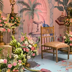 This pre-wedding celebration was a dream to design. We used a custom printed backdrop and flooring with Pichwai art, and filled the space with brass urlis, banana blossoms, and beautiful pastel florals.