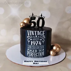 This "Vintage Aged to Perfection" cake is a popular choice for 50th birthdays. The design, printed on an edible sheet, sits on a dark chocolate cake, complemented by gold chocolate spheres.