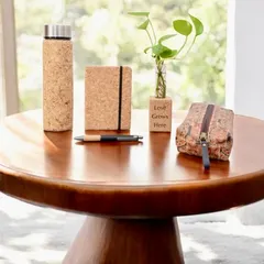 Gifting responsibly is important to me. This eco-chic set, featuring a cork-wrapped flask, notebook, and pen, is part of my sustainable collection, perfect for environmentally conscious brands.