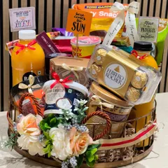 I was thrilled to design this gourmet hamper for a prestigious corporate client, Qatar Airways. It’s packed with premium international treats like Ferrero Rocher and Lindor chocolates, alongside healthy options like RAW Pressery juice, showing my ability to curate for a global palate.