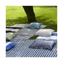 Create your own outdoor sanctuary for a picnic or lounging. This image shows a variety of outdoor fabrics in different patterns and solids, all designed to be durable and weather-resistant for stylish open-air living.