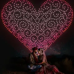 Let's create the ultimate romantic backdrop for your wedding photos. I can position a giant, glowing heart in the sky, providing a spectacular and unique setting that makes your special day truly one-of-a-kind.
