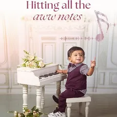 Hitting all the "aww" notes. My little maestro theme, complete with a miniature white piano and musical notes, is perfect for capturing the budding artist in your child.