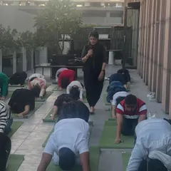 Guiding the Chanel team through a gentle flow on their office rooftop. I believe in bringing yoga to people where they are, making it a part of their daily lives.