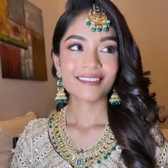 Getting my beautiful Muslim bride ready for her Walima. I created a soft, glowing look with a touch of pink on the eyes to complement her stunning ivory and green outfit.