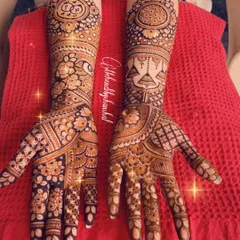 A lovely engagement design with jhumka motifs and the couple's initials elegantly placed in the center of a floral mandala.
