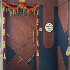 This main door features a modern geometric pattern created with grooves and a dual-tone finish. I also designed the surrounding wall panelling and the custom backlit nameplate for a complete look.