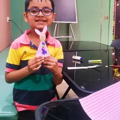 He is so proud of his finished Easter bunny puppet. It's amazing to see how a few simple craft supplies can turn into a source of such big smiles.