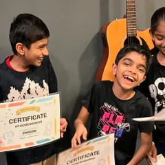 Big smiles from our students as they proudly display their certificates of achievement and participation. We celebrate every milestone in their musical journey.