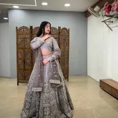 A different angle showcasing the beautiful flare and detailed work on this stunning grey lehenga.