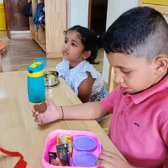 A duplicate of a previous image, showing children at snack time.
