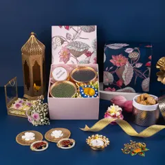 This Diwali hamper shot uses a deep blue background to make the festive packaging and golden lantern pop, creating a modern yet traditional look.