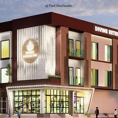 This evening render of the Divine Retreat Inn demonstrates the impact of architectural lighting. The illuminated signage and strategically placed lights accentuate the textured facade, giving the building a sophisticated and dynamic presence after dark.