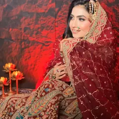 Another angle of this beautiful bride, showcasing how the dupatta is set perfectly over the head without disturbing the hairstyle. Neatness is key for these looks.