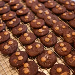 Fresh out of the oven. A tray of our gooey, chocolatey cookies, promising perfection in every single bite.