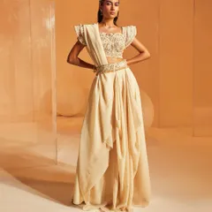 Our Jenna Saree Set gives a traditional concept an edgy, modern twist. This full-length shot displays the unique drape of the concept saree, worn with a gorgeous embroidered blouse and a highly embellished belt with tassels.