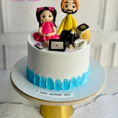 A father’s love for his daughter is endless. I made this custom cake for a daddy’s birthday, featuring handcrafted figurines of him and his daughter surrounded by their favorite gadgets.