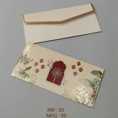 This design features a central jharokha or palace window motif, surrounded by delicate floral patterns in gold foil. It offers a classic and elegant look for wedding gifting.