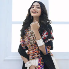 A look that shines brighter than the moonlight. For Navratri, we styled her in this gorgeous white chaniya choli with natural makeup and soft waves, making her the queen of the Garba night.