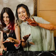 I love being part of special moments. Here I am sharing a laugh with the bride at her sangeet, making sure her big day has the perfect soundtrack.