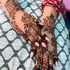 Another pose showcasing the delicate Arabic mehendi, a popular choice for engagement parties and other celebrations.