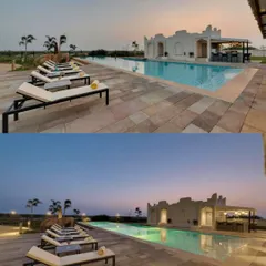 The poolside area at The Fern Sattva Resort at dusk. The design creates a tranquil atmosphere for relaxation, with clean lines and subtle lighting that complement the natural surroundings.