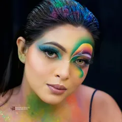 The spirit of Holi is all about celebrating life with joy. This creative look uses a rainbow of colors across the face and hair to capture the festival's vibrant energy.
