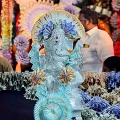 This silver Ganesha idol was part of the larger currency note decoration, adorned with its own delicate flowers made from currency. It shows how I can integrate multiple elements and idols into a cohesive theme.