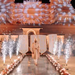 A groom's entry that commands attention. We work with your venue's grandeur, like this palace, to create a truly royal procession with dramatic lighting and projection mapping.