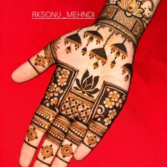 This design is a beautiful symphony of traditional Indian motifs. It features jhumka earrings, lotus flowers, and a central mandala, creating a different yet complementary look on each hand.