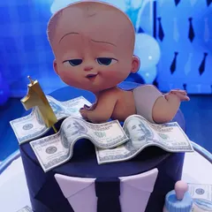 The perfect cake for a Boss Baby theme. We can help arrange custom cakes like this one, featuring the Boss Baby character, a suit design, and edible money details to match the party decor.