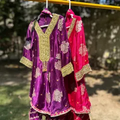 This image shows my Gota Patti sharara sets in both purple and pink. The rich colors and opulent embroidery make them a standout choice for any grand festive occasion.